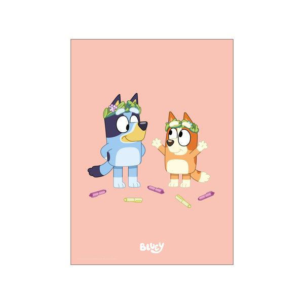 Two cartoon dogs, Bluey and Bingo, wear floral wreaths on a soft pink background. Scattered around their feet are colorful crayons, suggesting creative play.